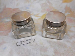 A pair of small ink wells with plated lids. c1880