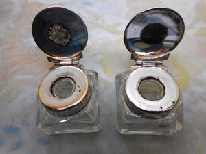 A pair of small ink wells with plated lids. c1880