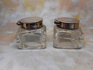 A pair of small ink wells with plated lids. c1880