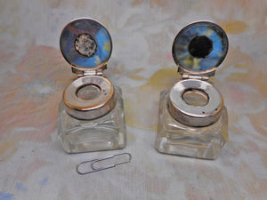 A pair of small ink wells with plated lids. c1880