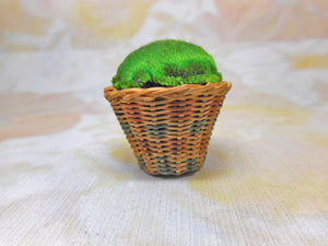 A little sweetgrass bowl fitted with an emery cushion. c1840