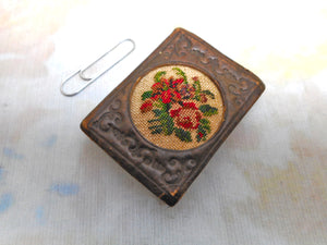 An attractive leather emery cushion. c1840