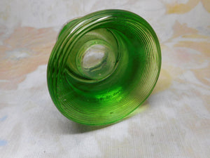 An unusual green glass match holder. HM 1911.