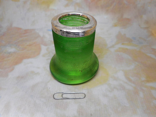 An unusual green glass match holder. HM 1911.