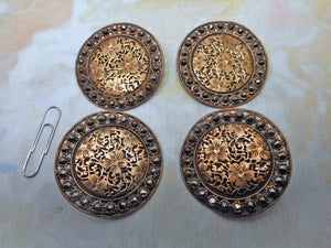 Four large floral brass buttons. c 1890-1910