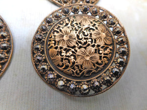 Four large floral brass buttons. c 1890-1910