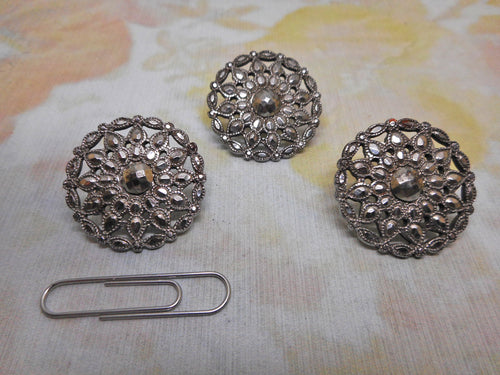 Three matching 18th century cut steel buttons.