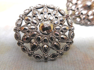 Three matching 18th century cut steel buttons.