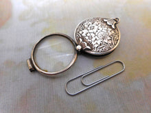 Load image into Gallery viewer, A small silver pendant style folding magnifier. HM. London 1888.
