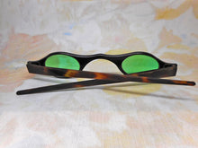 Load image into Gallery viewer, A pair of tortoiseshell spectacles with green tinted lenses. c 1800
