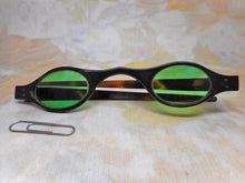 Load image into Gallery viewer, A pair of tortoiseshell spectacles with green tinted lenses. c 1800
