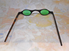 Load image into Gallery viewer, A pair of tortoiseshell spectacles with green tinted lenses. c 1800
