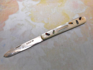 A rare mother of pearl fruit knife with shibayama decoration. HM. 1906