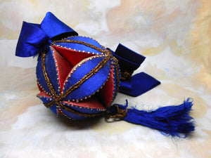 A 19th century silk patch work polygon pin cushion.