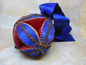 A 19th century silk patch work polygon pin cushion.