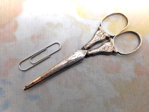 A small pair of engraved silver scissors. c1830