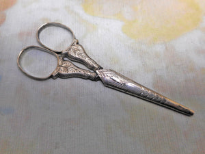 A small pair of engraved silver scissors. c1830