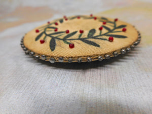 A Georgian silk pin cushion disc with beadwork. c 1820