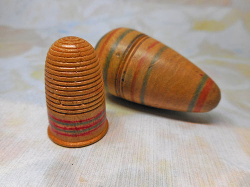 A Painted Tunbridge Ware thimble and its egg shaped box. c1800