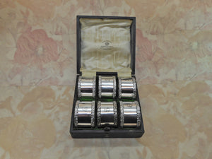 A set of 6 Mappin & Webb silver plated napkin rings. c1900