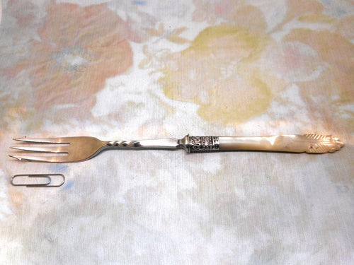 An antique mother of pearl pickle fork. HM silver band Sheffield 1894.