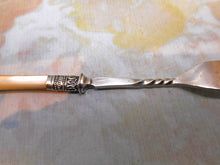 Load image into Gallery viewer, A mother of pearl pickle fork. HM silver band Sheffield 1894.
