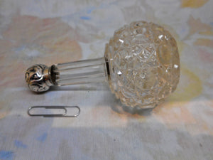 A silver lidded glass scent bottle. c1900-1915