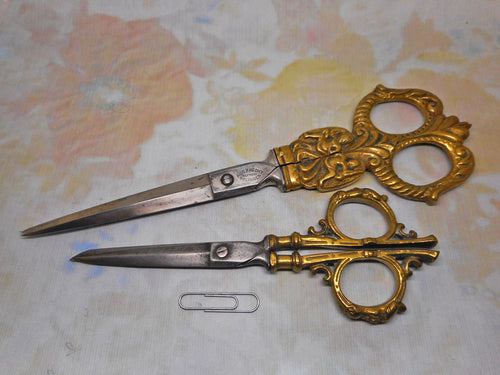 Two pairs of large brass handled German scissors. 19th century. Solingen.