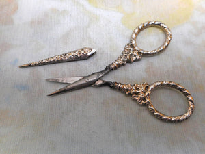 A pair of Georgian silver handled scissors and sheath. c1830