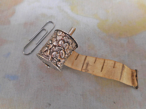 An embossed silver tape measure. c1830