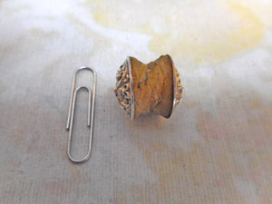 An embossed silver thread waxer. c 1830