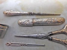 Load image into Gallery viewer, A silver plated set of sewing tools embossed with mistletoe. c1900

