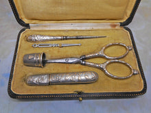 Load image into Gallery viewer, A silver plated set of sewing tools embossed with mistletoe. c1900
