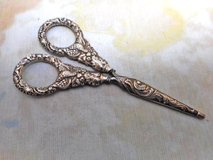 A pair of Regency silver handled scissors and sheath. c1825