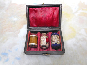 A cased set -a silver tape measure, waxer and emery. c 1850