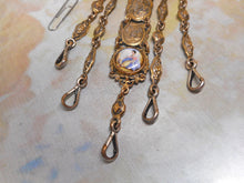 Load image into Gallery viewer, A white metal chatelaine with painted porcelain plaques. c1870 a/f
