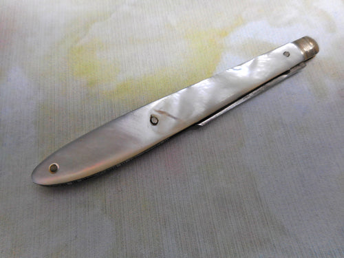 A steel bladed pocket knife with engraved silver spring cover. c1870