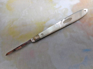 A steel bladed pocket knife with engraved silver spring cover. c1870