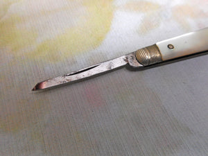 A steel bladed pocket knife with engraved silver spring cover. c1870