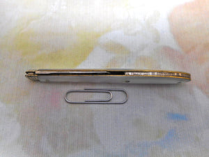 A steel bladed pocket knife with engraved silver spring cover. c1870