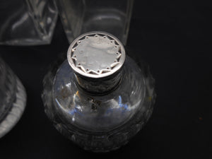 Reserved for G..........A set of four silver topped bottles. Palais Royal. pre-1809.