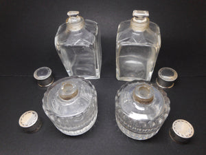 Reserved for G..........A set of four silver topped bottles. Palais Royal. pre-1809.