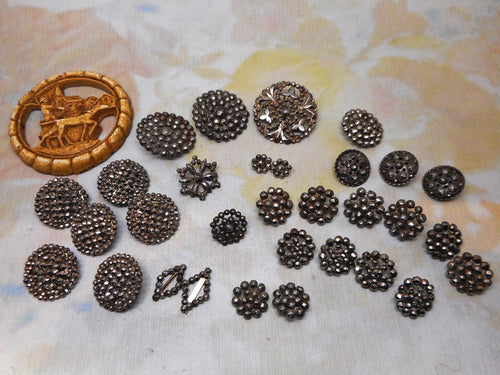 A mixed lot of steel studded buttons plus a Deco design.