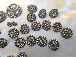 A mixed lot of steel studded buttons plus a Deco design.