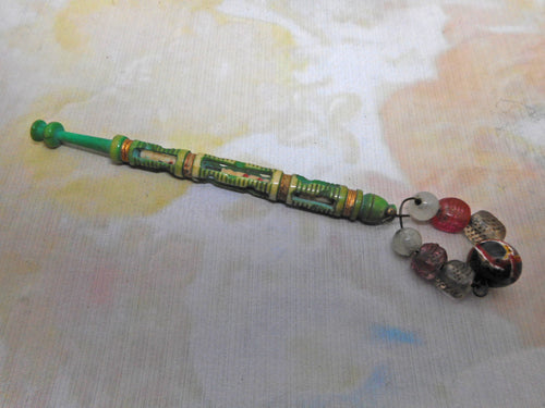 A fine dyed green bone bobbin -a mother and babe. Mid 19thc