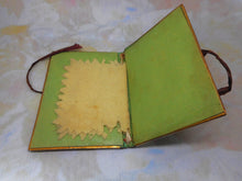 Load image into Gallery viewer, A tooled leather needle case with petit point panels. c 1860.
