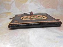 Load image into Gallery viewer, A tooled leather needle case with petit point panels. c 1860.

