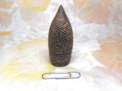 A tall Hispano-Moresque bronze thimble. c1400