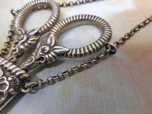 A silver scissor case and scissors from a chatelaine. GU. B'1897.