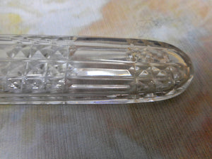 A long, glass scent bottle with a silver cap. c1820. English.